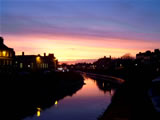 Sunset over the River Nene as it passes between the Georgian Houses of the South and North Brinks.